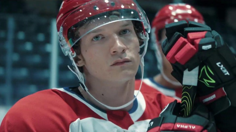 Connor Storrie as Ilya Rozanov in hockey gear on Heated Rivalry