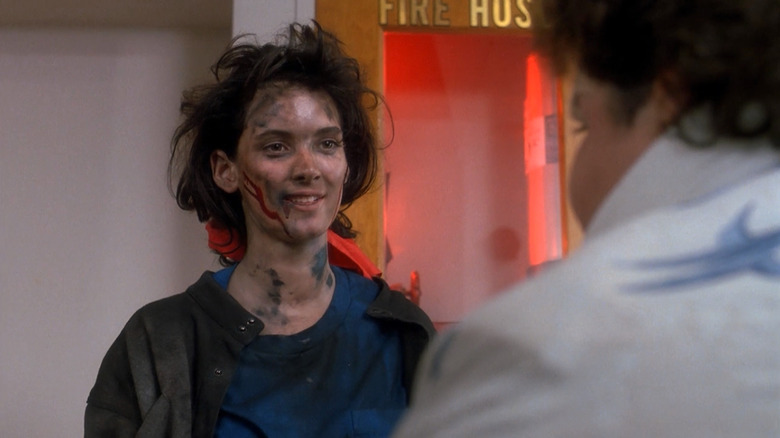 Winona Ryder as Veronica looking bloodied and battered in Heathers