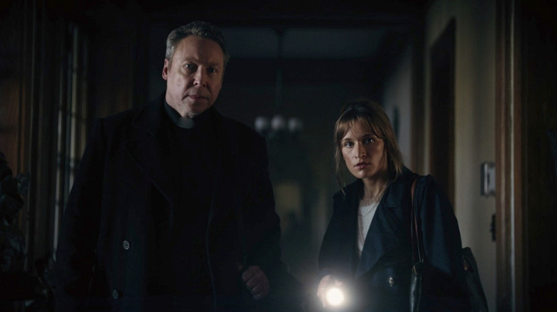 Father David and Alicia investigate the Carmichael Manor in Hell House LLC: Lineage
