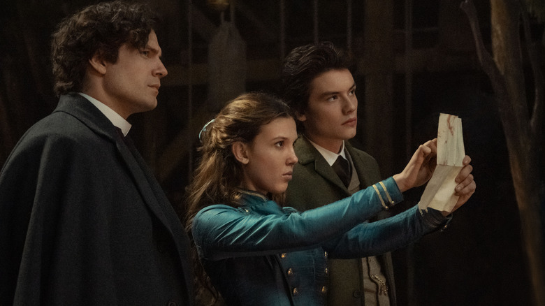 Henry Cavill, Millie Bobby Brown, and Louis Partridge in Enola Holmes 2