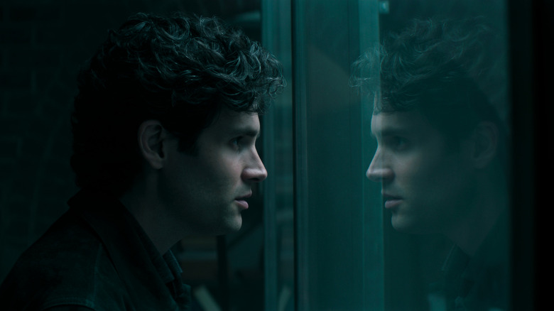 Joe looking into the cage and seeing his reflection on You