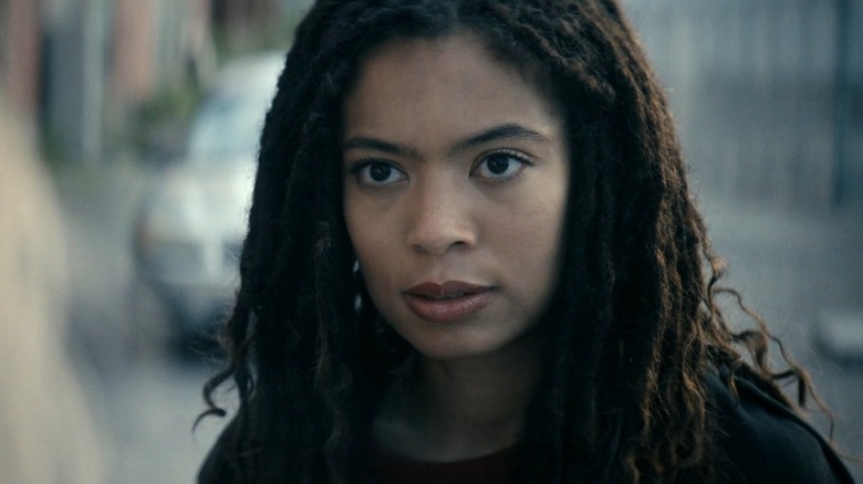 Jaz Sinclair as Marie Moreau standing in an empty street opposite Erin Moriarty as Annie January in The Boys