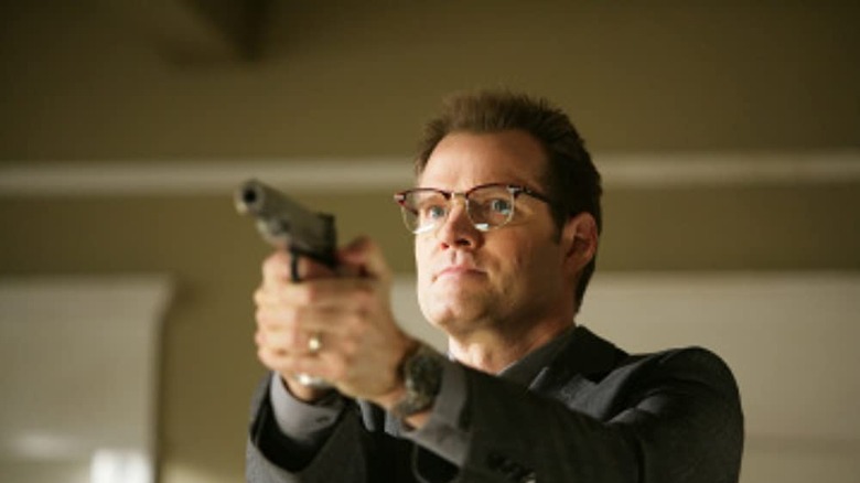 Jack Coleman aims gun