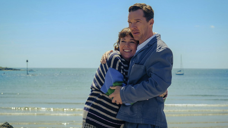Theo and Ivy Rose standing and embracing each other on the beach in The Roses