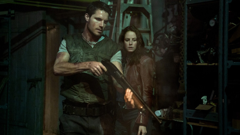 Chris and Claire Redfield (Robbie Amell and Kaya Scodelario) in Resident Evil: Welcome to Raccoon City