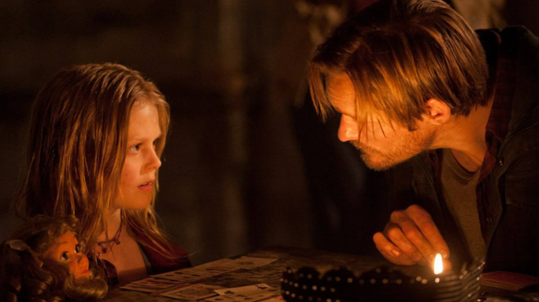 Alexander Skarsgård and Emily Alyn Lind in Hidden