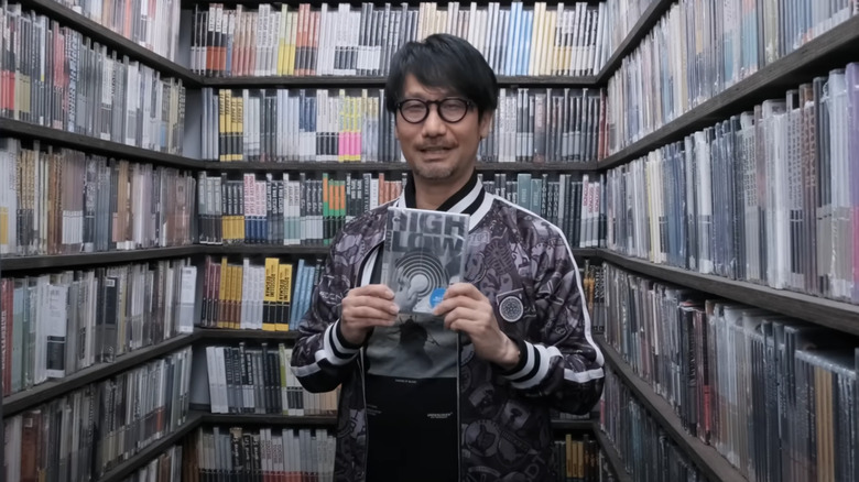 Hideo Kojima in the Criterion Closet holding High and Low