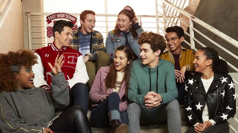 The cast of HSMTMTS sitting on the stairs