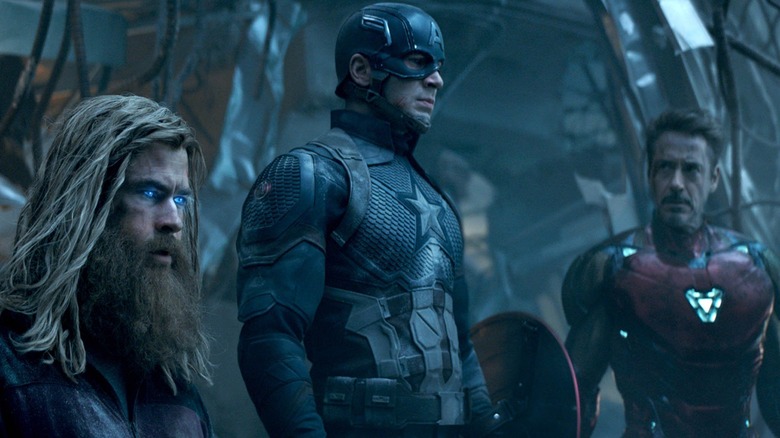 Thor (Chris Hemsworth), Captain America (Chris Evans), and Iron Man (Robert Downey Jr.) talking  in Avengers: Endgame