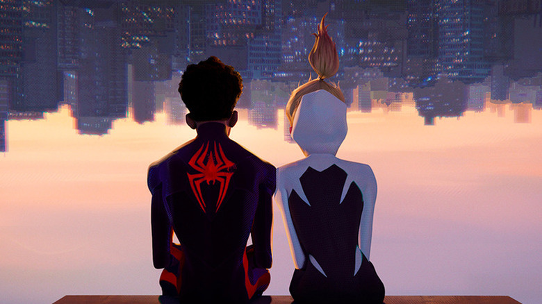 Miles and Gwen look into the sunset together while sitting upside down in Spider-Man: Across the Spider-Verse
