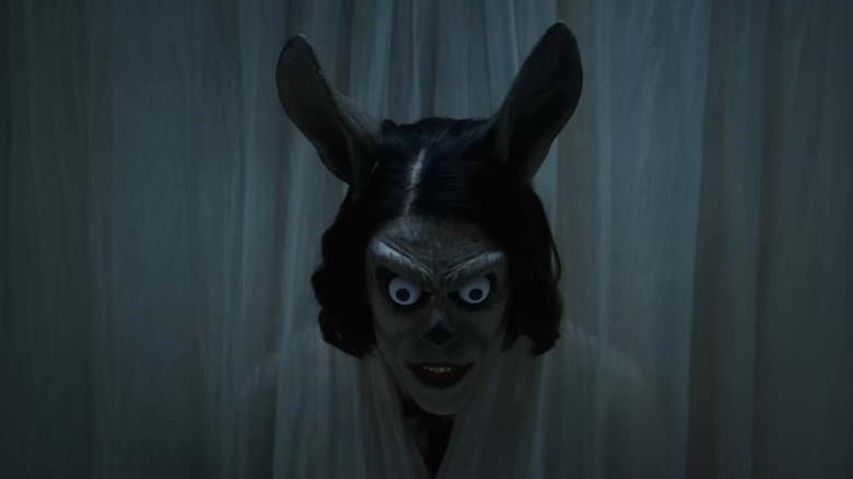 The bunny monster coming through the curtains in Hokum