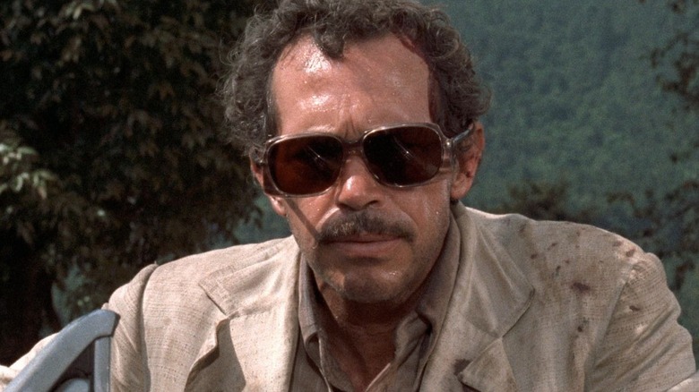 Bennie, sweaty in sunglasses, in Bring Me the Head of Alfredo Garcia