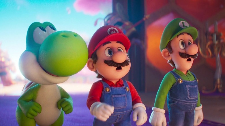 Yoshi, Mario, and Luigi looking up in surprise in The Super Mario Galaxy Movie