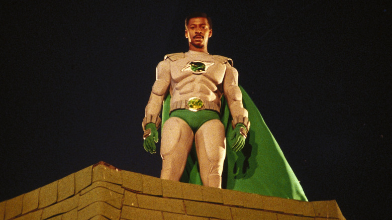 Robert Townsend as Meteor Man looking down from a rooftop in The Meteor Man