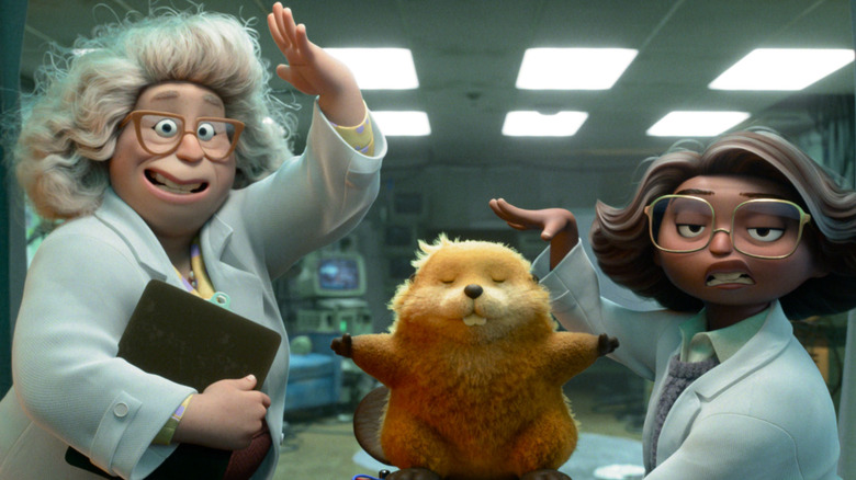 Dr. Sam and Nisha with the beaver robot in Hoppers