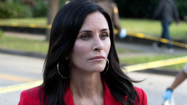 Courteney Cox by her truck