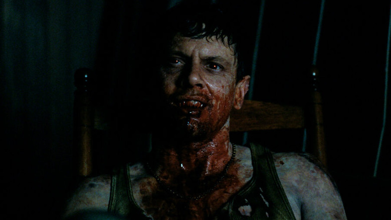 Sinners Remmick bloody mouth and fangs unfurled