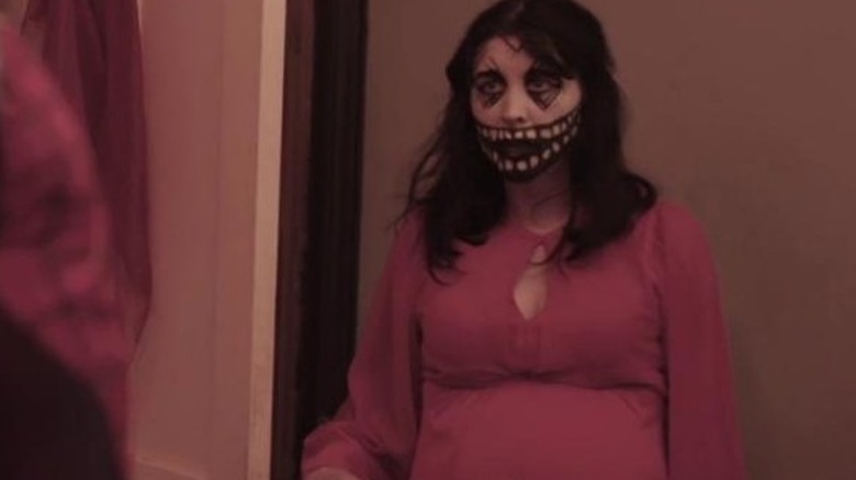 Alice Lowe holding knife to pregnant belly