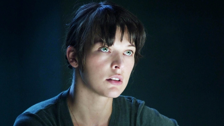 Dr. Abigail Tyler staring intensely in a dark room in The Fourth Kind