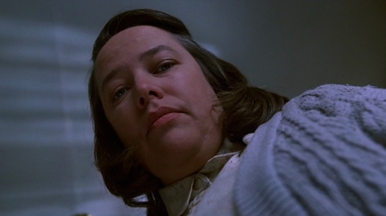 Kathy Bates as Annie Wilkes in Misery, staring down at the camera menacingly