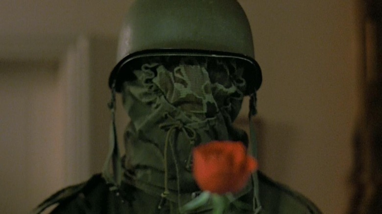 Military man with rose