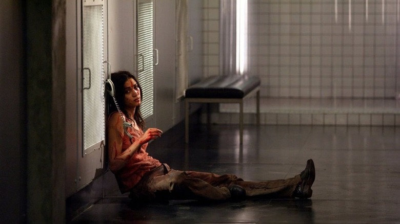 A bloodied and battered Anna (Morjana Alaoui)