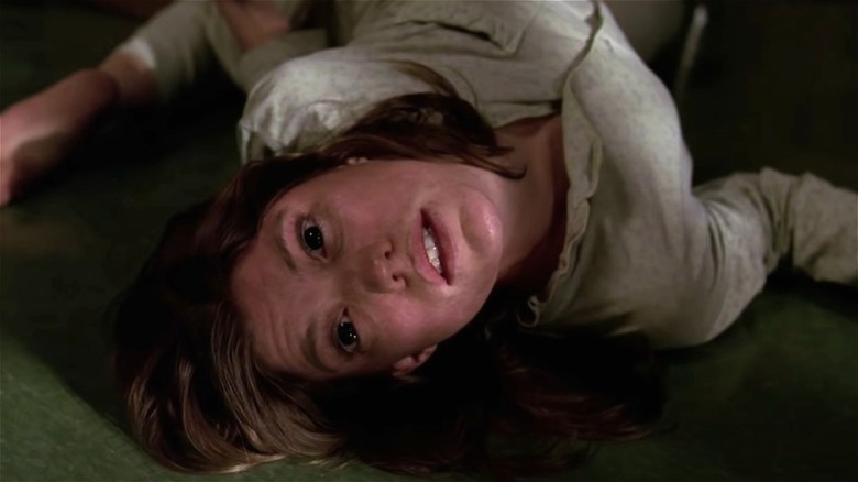 Jennifer Carpenter rigid on the floor