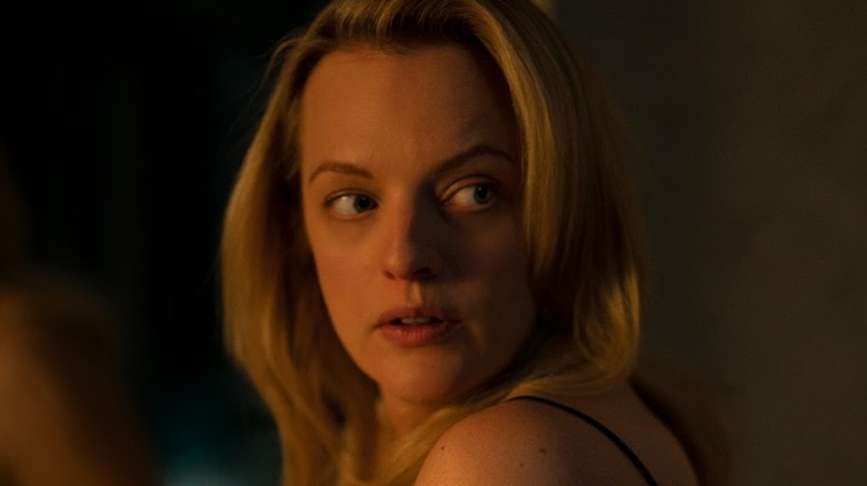 Elisabeth Moss looks over her shoulder