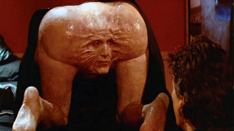 mutated face attached to legs