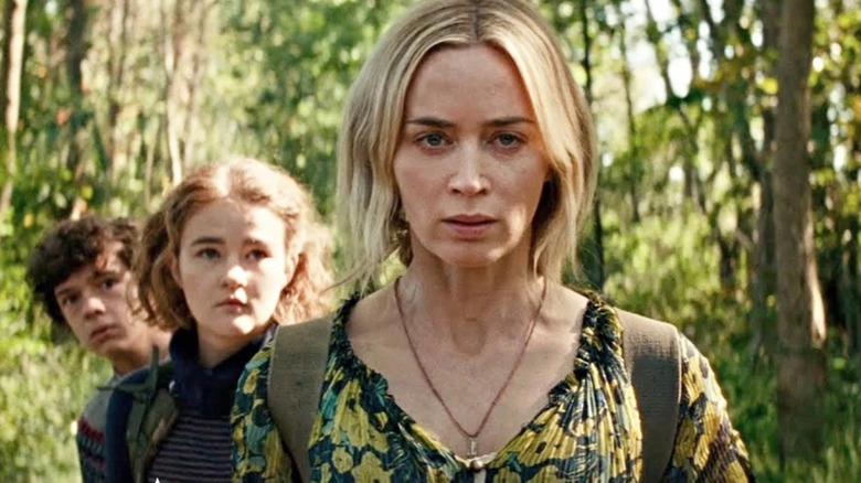 Emily Blunt walking in front of children in A Quiet Place Part II