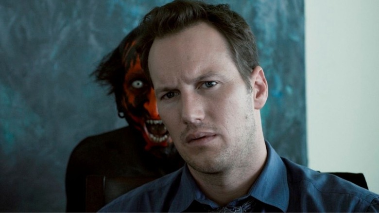 Patrick Wilson standing in front of demon in Insidious