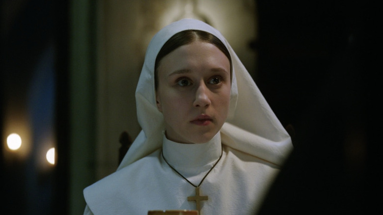 Taissa Farmiga wearing white habit in The Nun