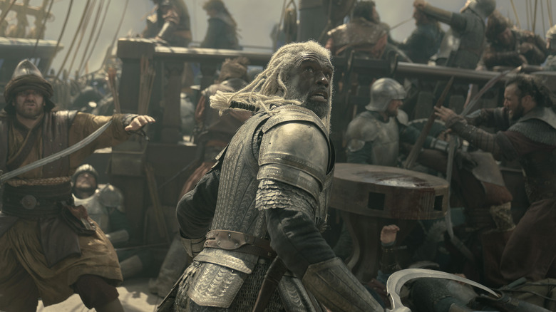 The Sea Snake and his crew look up in terror while engaged in a huge battle in House of the Dragon