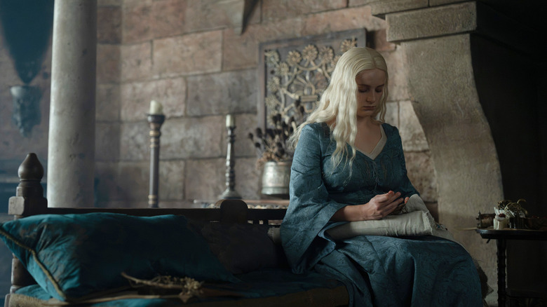 Helaena sitting on a chair stitching in House of the Dragon