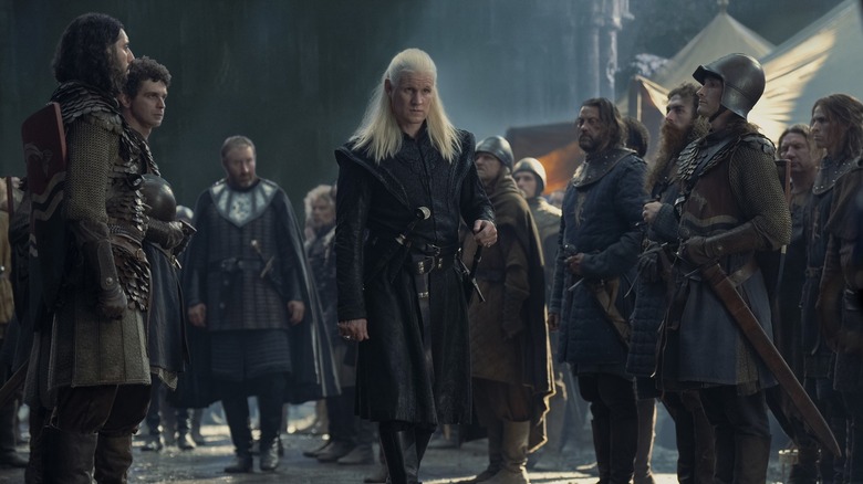 Daemon Targaryen standing in the middle of a group of soldiers in House of the Dragon