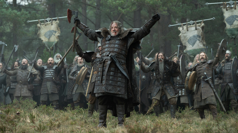 Tommy Flanagan as Roddy the Ruin holding an axe and raising his arms at the head of an army in House of the Dragon
