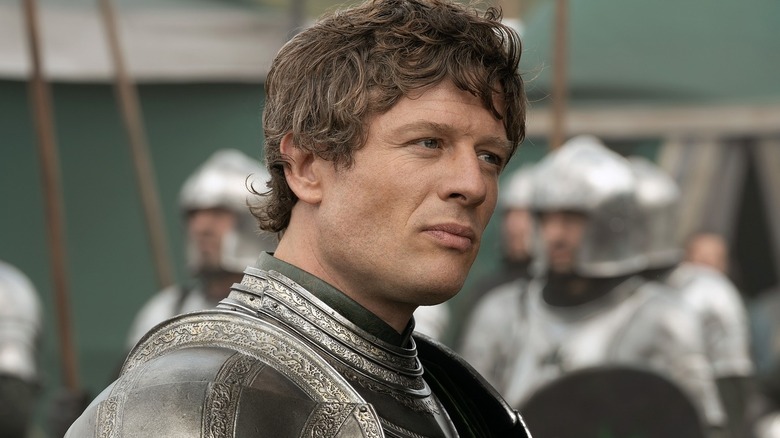 James Norton as Ormund Hightower wearing a suit of armor in front of several soldiers in House of the Dragon
