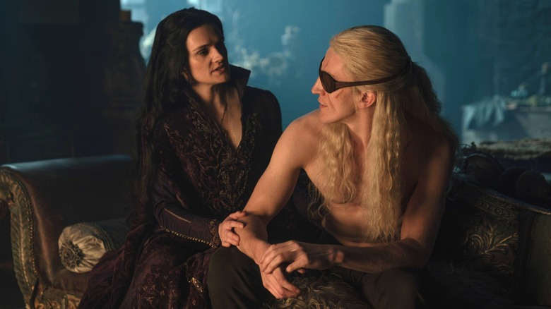Gayle Rankin as Alys Rivers comforting Ewan Mitchell as Aemond Targaryen in a dark room in House of the Dragon