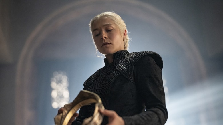 Rhaenyra holds her crown and contemplates the many war crimes she will have to commit to win the throne in House of the Dragon