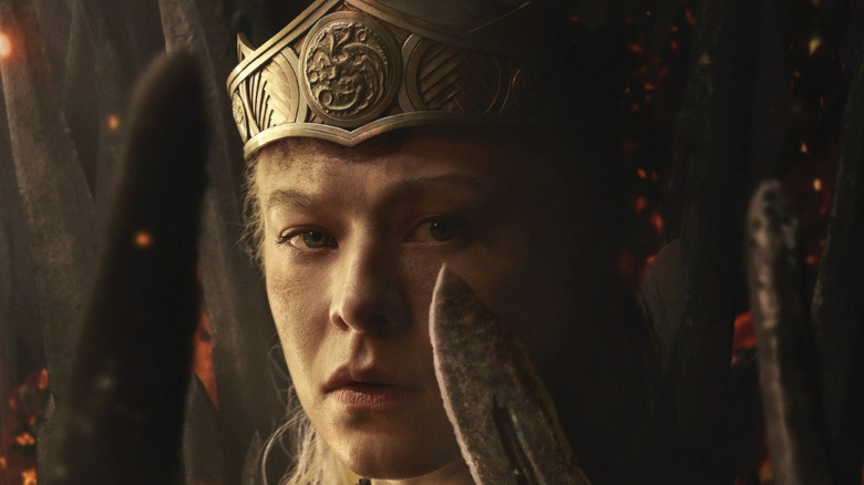 Emma D'Arcy as Rhaenyra Targaryen wearing a crown and surrounded by swords in the poster for House of the Dragon