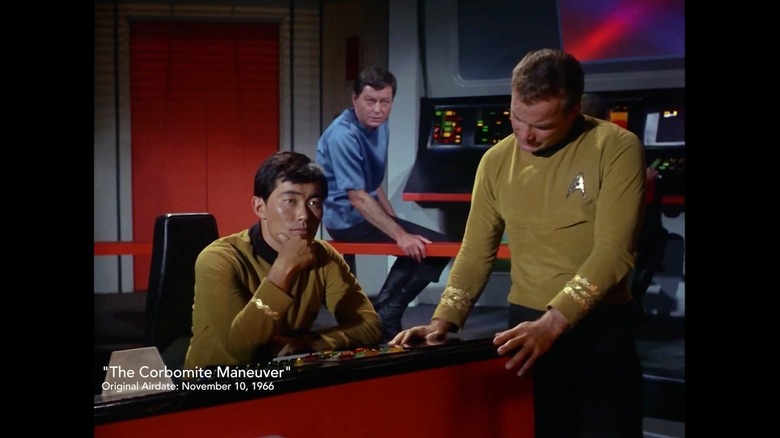 A screenshot of William Shatner as James Kirk, George Takei as Sulu, and DeForest Kelley as Bones on the bridge of a starship from an episode of Star Trek: The Original Series in The Sixty-Year Mission: How Star Trek Changed Television and the World