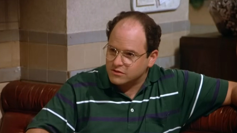 George Costanza sitting in dining room in Seinfeld