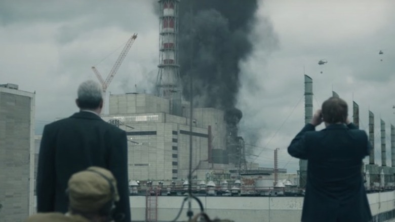 Stellan Skarsgård's Boris Shcherbina and Jared Harris' Valery Legasov looking at smoking power plant on Chernobyl