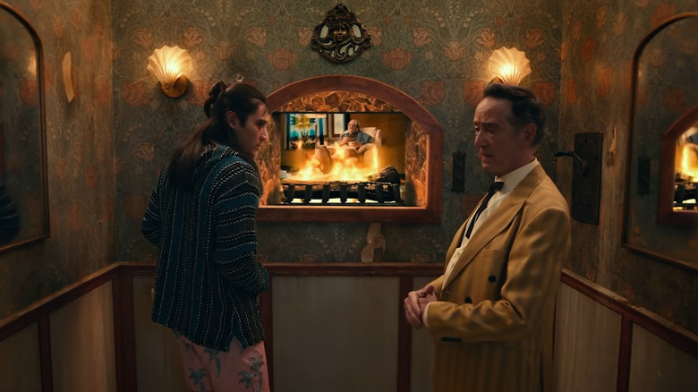 Henry and the Little Man in the Fire peering through fireplaces in Adult Swim Yule Log