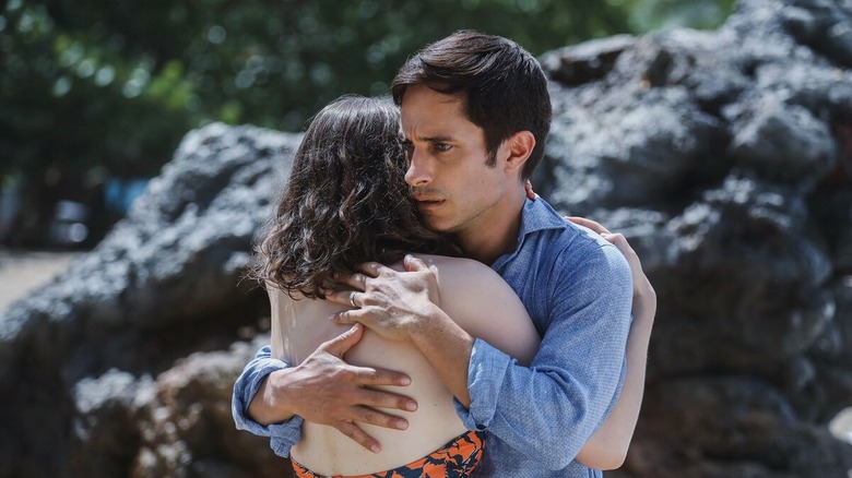 Gael García Bernal as Guy Cappa hugging his daughter with surprise in Old