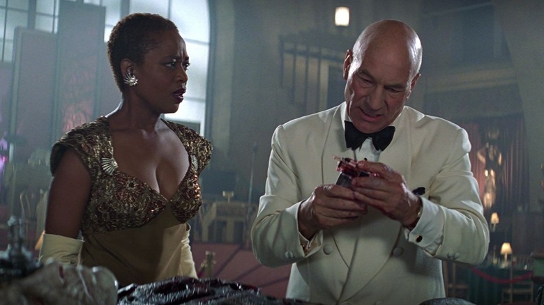 Lily and Picard, in 1930s formal ware, looking worried in Star Trek: First Contact