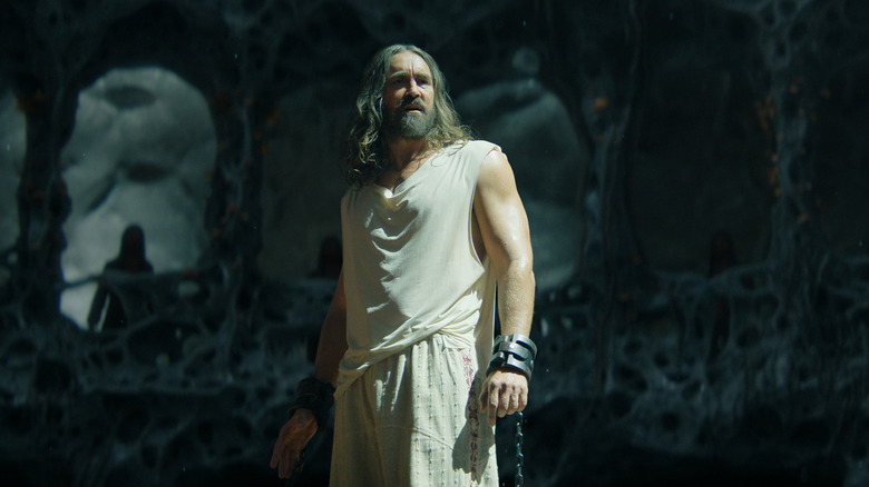 Brother Day wears white robes (with a chain and shackle on his left wrist) in Foundation season 3