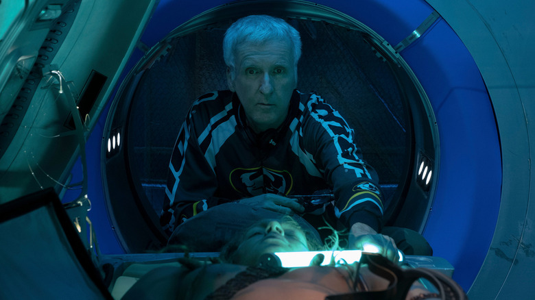 James Cameron looking through a pod on the set of Avatar: The Way of Water