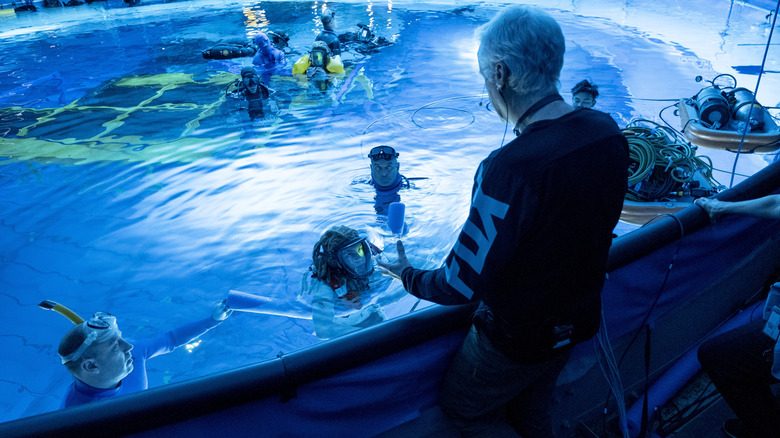 James Cameron directing the cast of Avatar: The Way of Water on a massive water tank