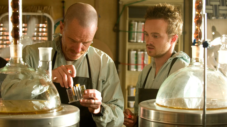 Bryan Cranston as Walter White and Aaron Paul as Jesse Pinkman working in a lab on Breaking Bad